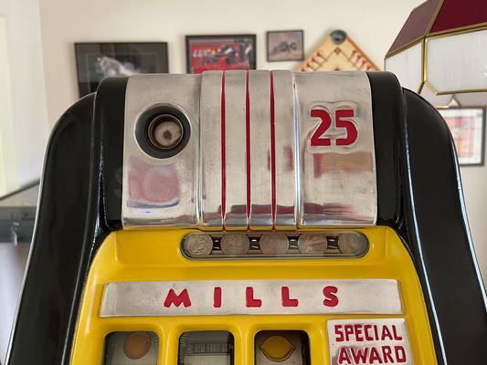 1940's Mills High Top 777 Bell 25 Cent Slot Machine Image