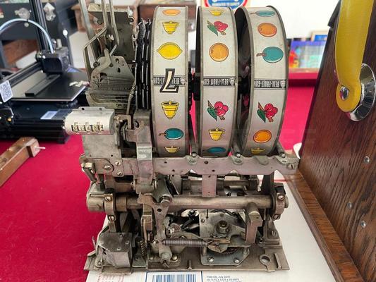 1940's Mills High Top 777 Bell 25 Cent Slot Machine Image