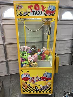 2010 Betson Enterprises Toy Taxi Claw Machine Image